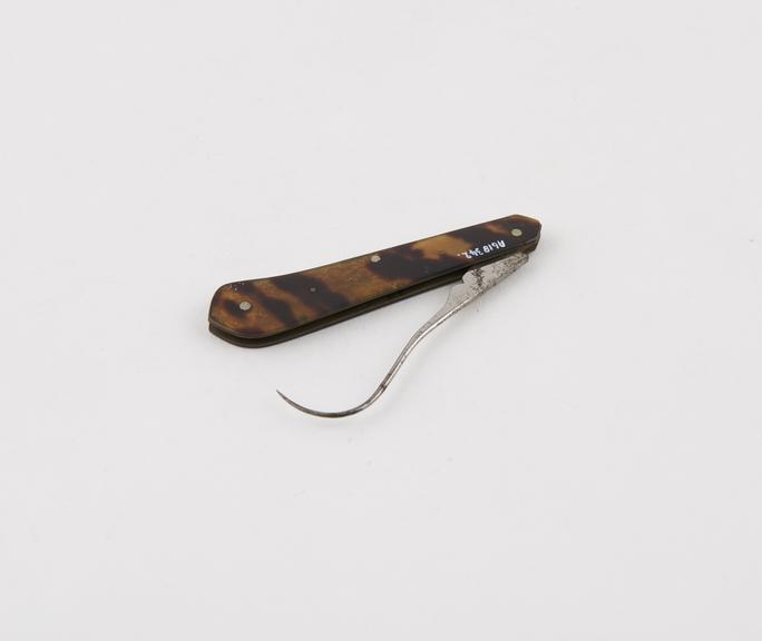 Tenaculum, steel, folding, in tortoiseshell sheath, by I