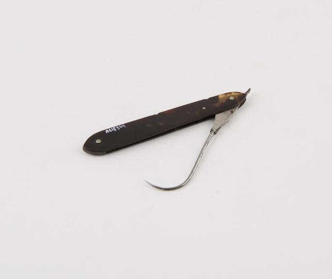 Tenaculum, steel, folding, in tortoiseshell sheath