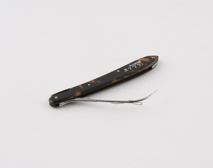 Suture needle, steel, folding, in tortoiseshell sheath