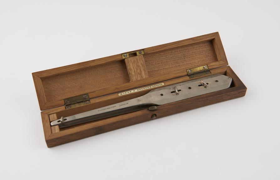 Barker's needle holder, nickel plated, in wooden case