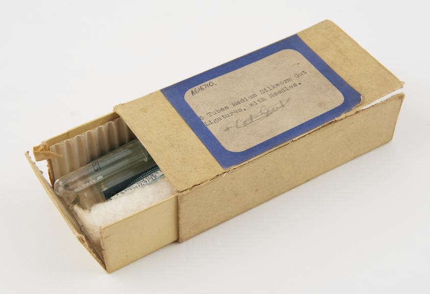 Carton containing three ampoules of sterile silkworm gut and