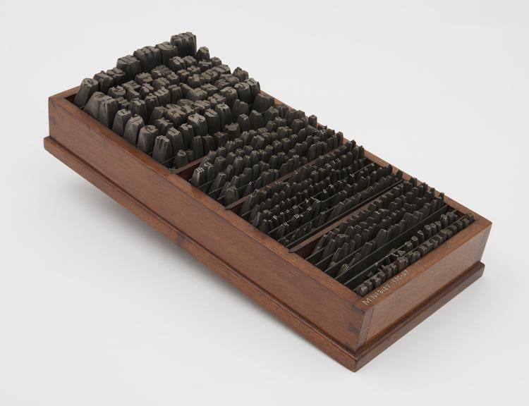 Collection of 370 steel punches (in a wooden tray) used for