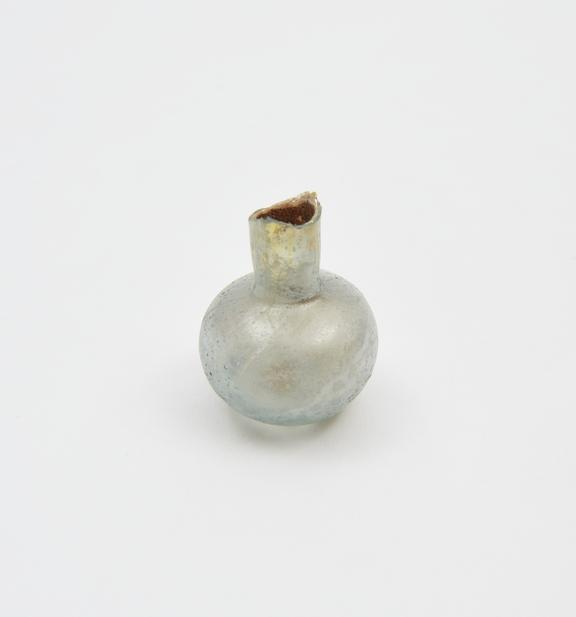 Glass flask, pale blue, squat bulbous body, flat base