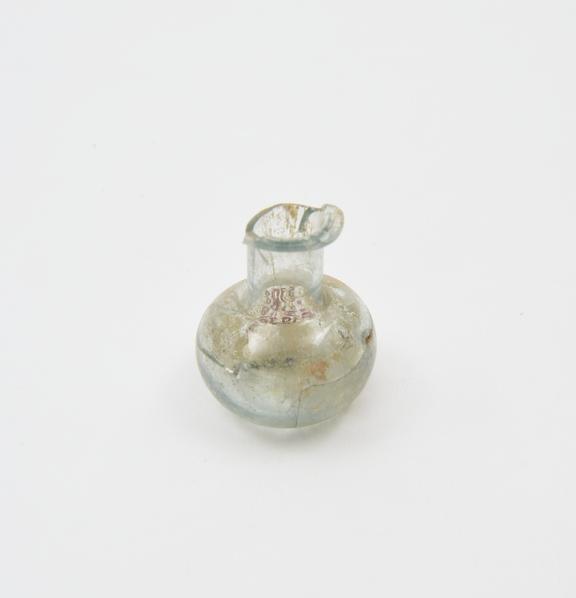 Glass jar, cylindrical body, rounded base, folded rim