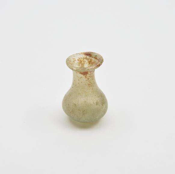 Glass flask, pale green, flat base, bulbous body, concave neck