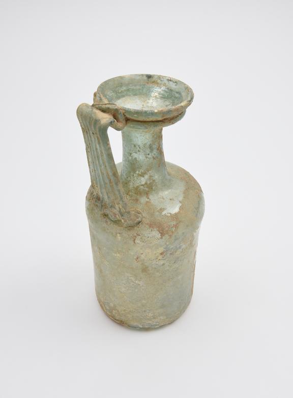 Glass bottle, with one ribbed handle and funnel mouth, Roman