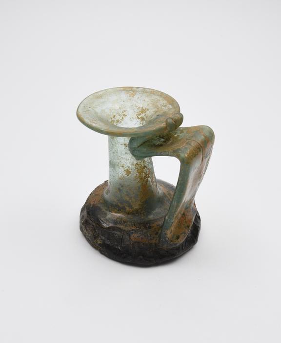 Glass neck rim and handle from a Roman jug with the base from