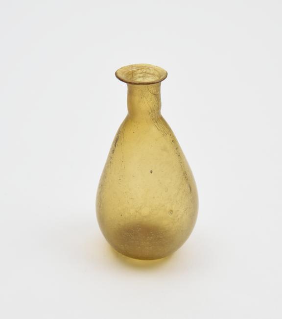 Glass flask, amber, Roman, 1 to 150 AD