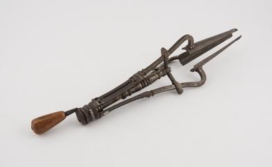 Vaginal speculum with wooden handle