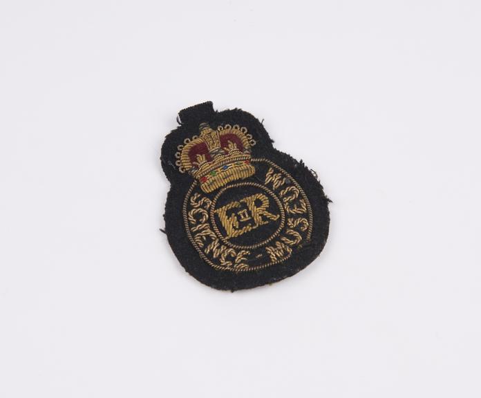 Cap badge, as worn by a Science Museum supervising warder