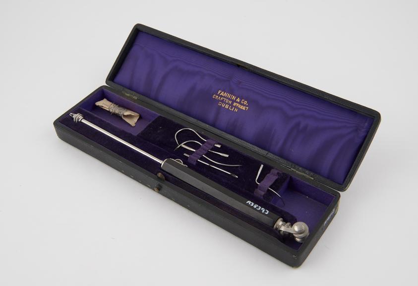 Set of suture needles, with holder and wire, in leather case