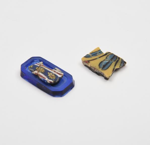 Two sherds (one on modern blue glass mount) of mosaic glass