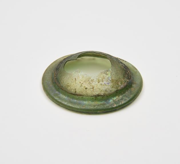 Glass base only, from an unidentifiable vessel, green, concave