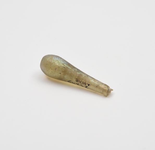 Glass drop, possibly the base of a bell clapper, Roman