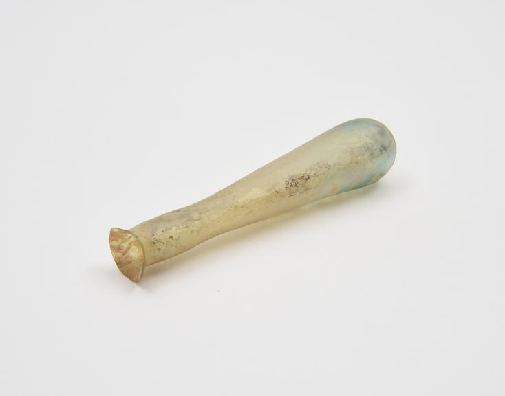 Glass unguent bottle, pale green, elongated conical body