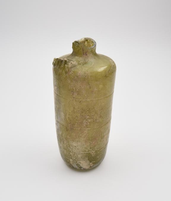 Glass bottle, green, cylindrical body with wheel cut decoration