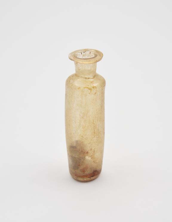 Glass bottle, pale yellow, cylindrical body, kicked base