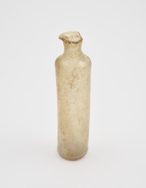 Glass bottle, pale yellow, cylindrical body, kicked base