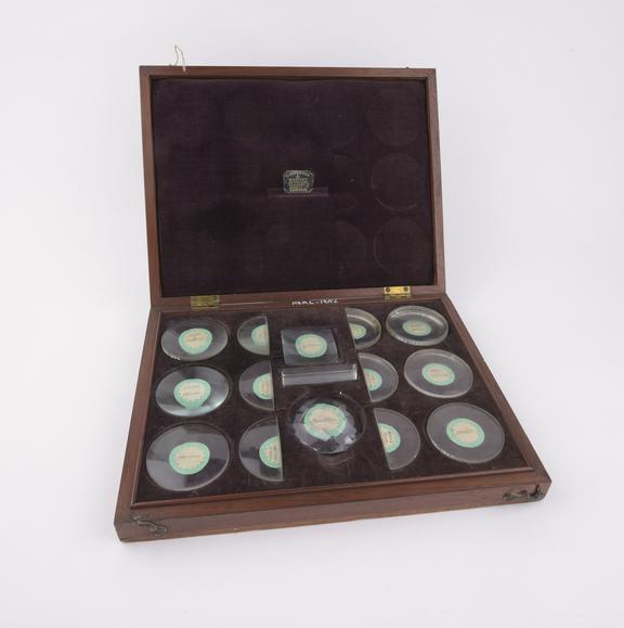 Fifteen labelled lenses and prisms in box