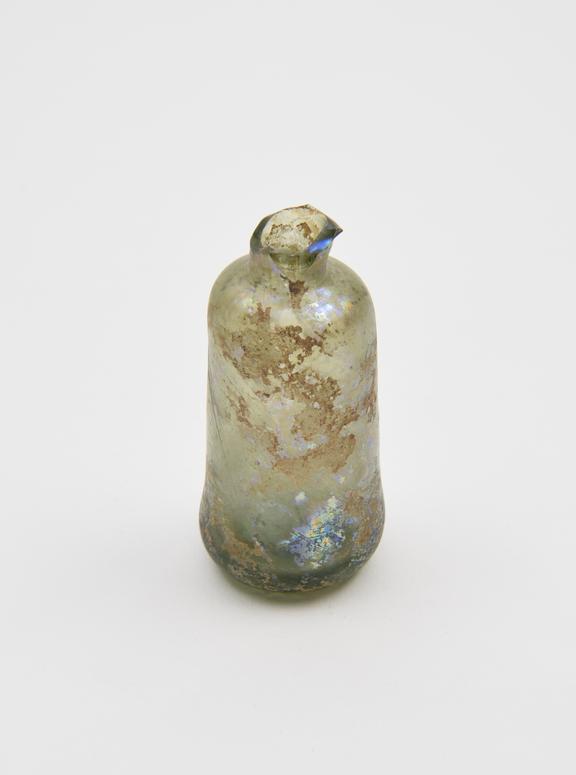 Glass bottle, probably an apothecary bottle, green