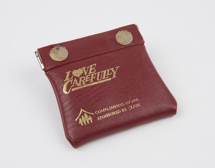 Plastic wallet entitled Love Carefully' containing condoms