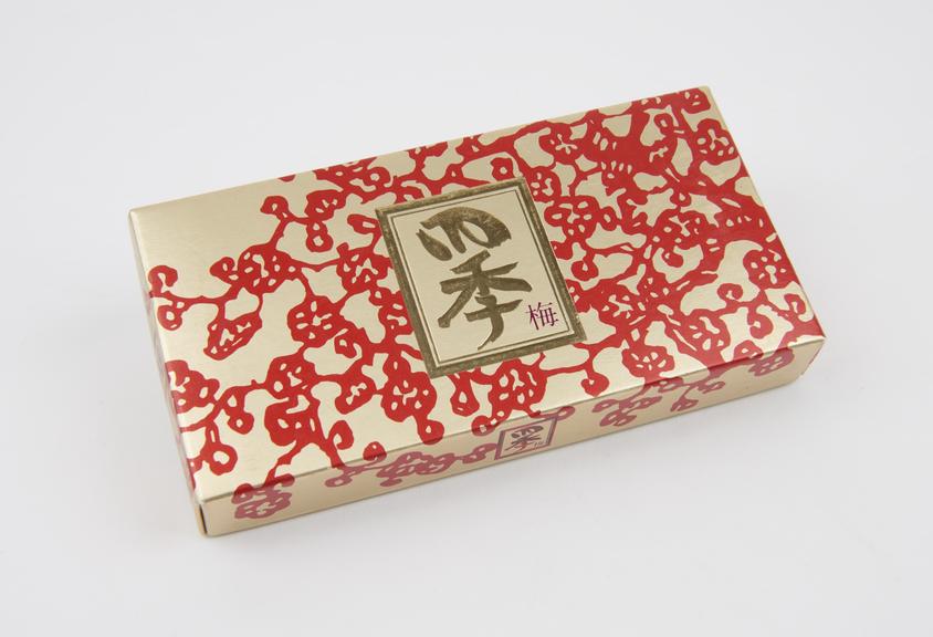 Gold and red patterned carton of condoms, Japanese, 1970s.