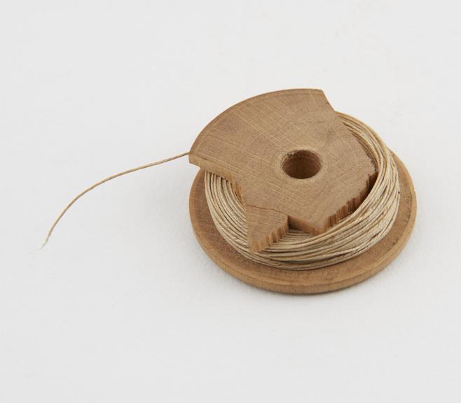 Wooden bobbin with suture, possibly first half of 20th century