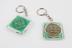 2 green plastic keyrings used to promote the use of condoms in