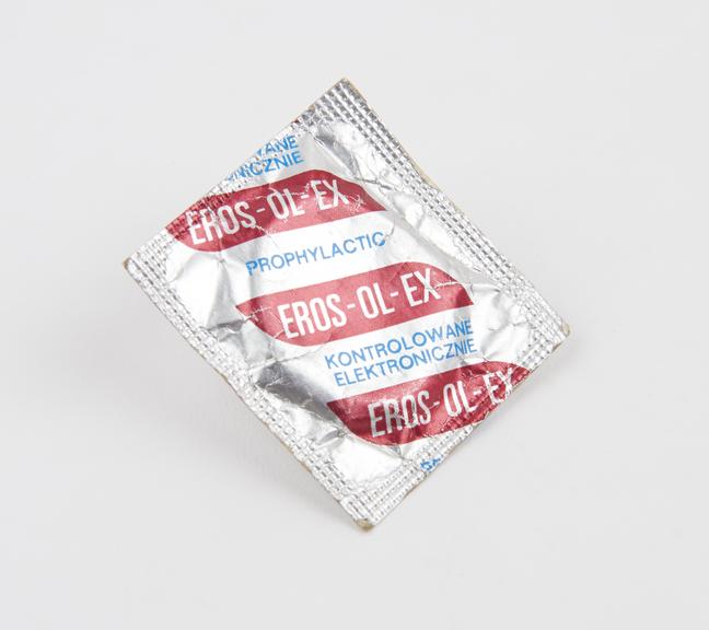 Silver packet of Eros-Ol-Ex' condoms'