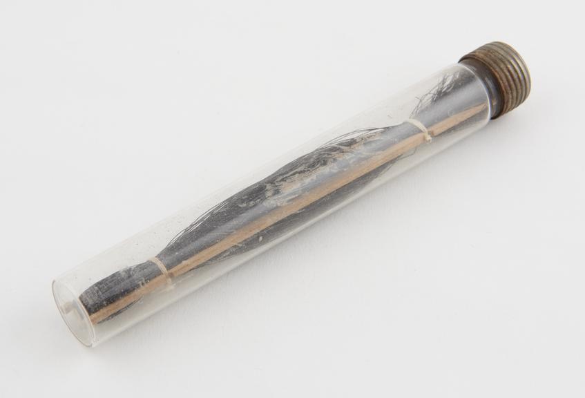 Glass tube of ligatures, probably first half of 20th century