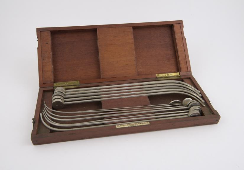 Set of lithotomy sounds (12) steel plated in mahogany case