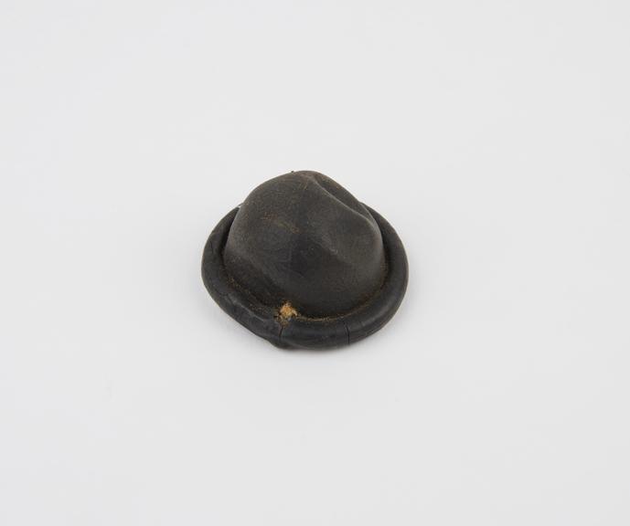 Rubber cervical cap, low domed, by Lamberts, London