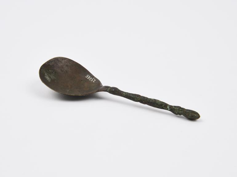 Brass spoon with ornate stem