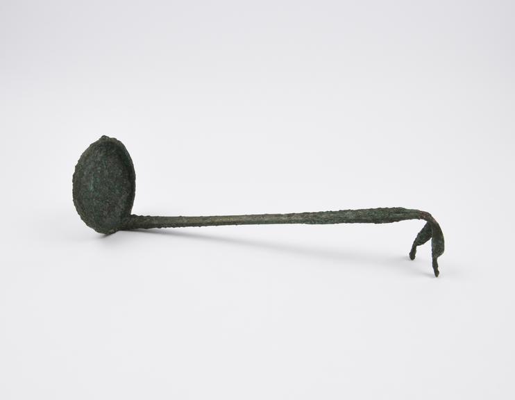 Bronze ladle with handle terminating in two bird's heads