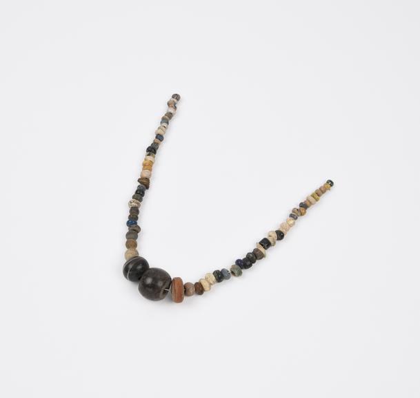 Bead necklace made of glass, stone and faience with some gilding