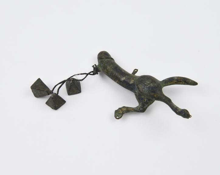 Phallic pendant, phallus mounted on hindquarters of a horse