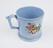 Blue creamware mug, with a frog inside the case