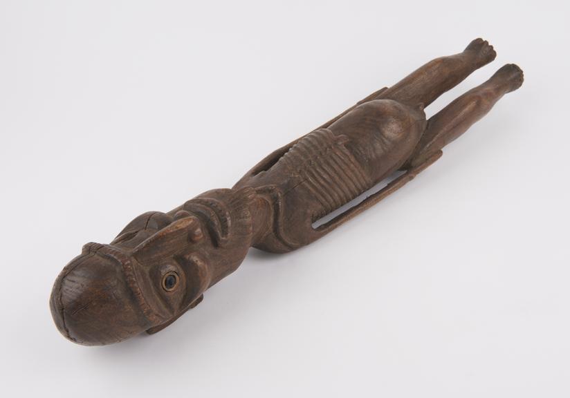 Wooden statue depicting a stylesea emaciated figure
