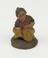 Pottery statue depicting a squatting woman, Spanish