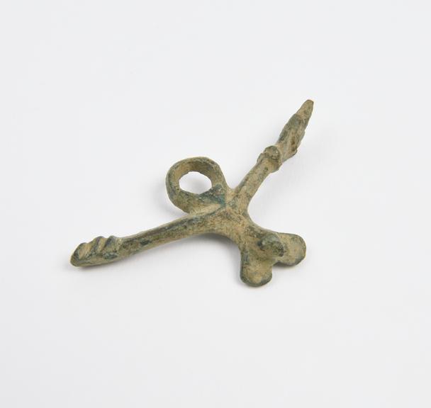 Amuletic bronze pendant in form of phallic cross