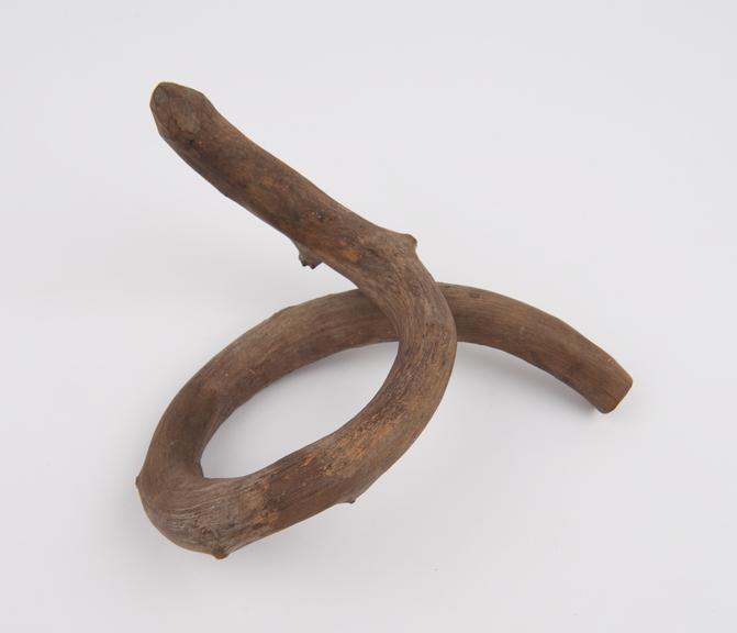 Twisted stick, with one end carved possibly to resemble phallus