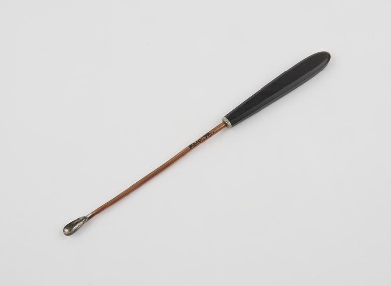 Curette, uterine, steel shaft, copper-plated, ebony handle