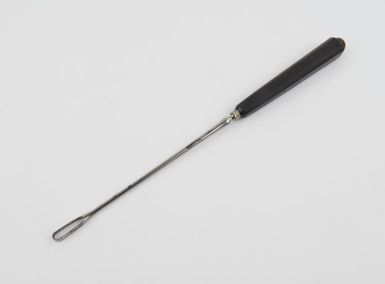 Curette, uterine, steel shaft, ebony handle