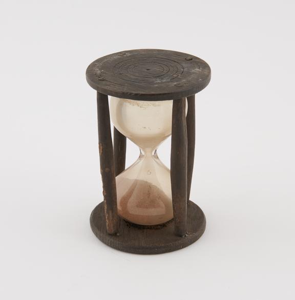 Single sand-glass in crude wooden mount, 14 sec