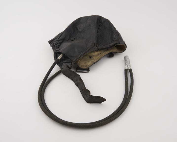 Black leather flying helmet, with Gosport tubes