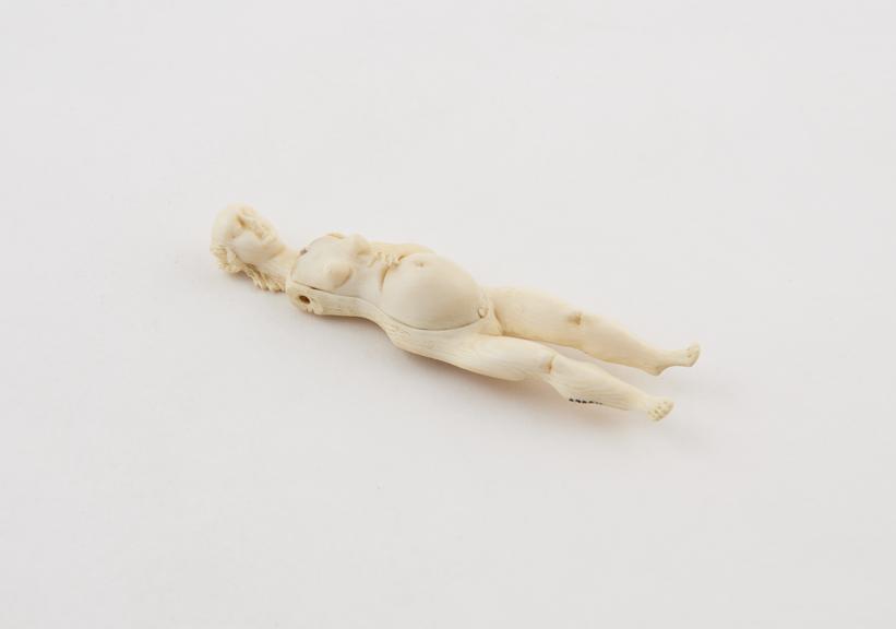 Ivory anatomical figure, a pregnant female