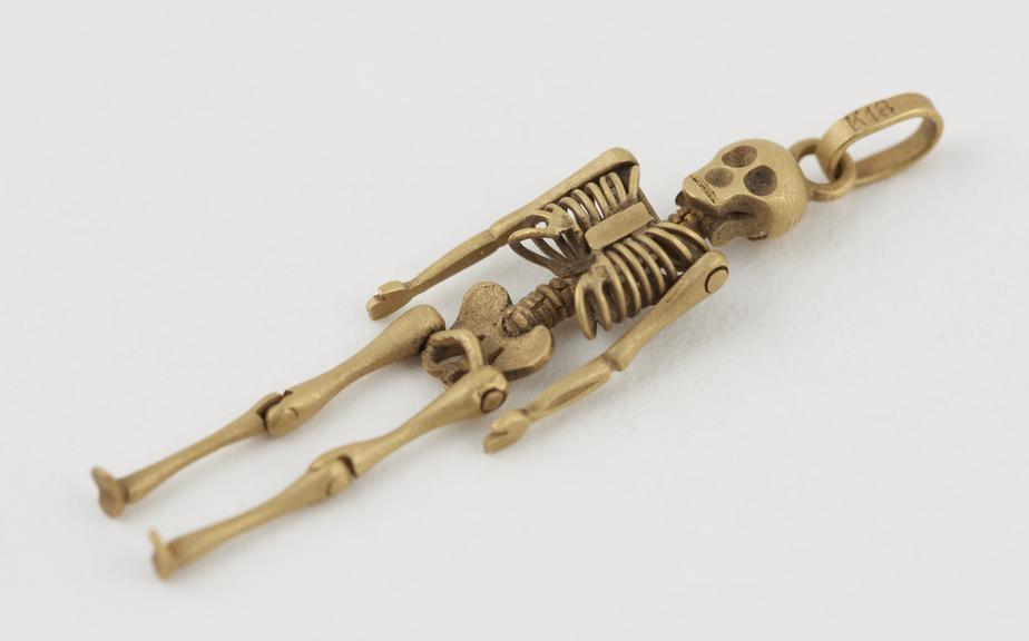 Gold skeleton, with loop for suspension, Italian