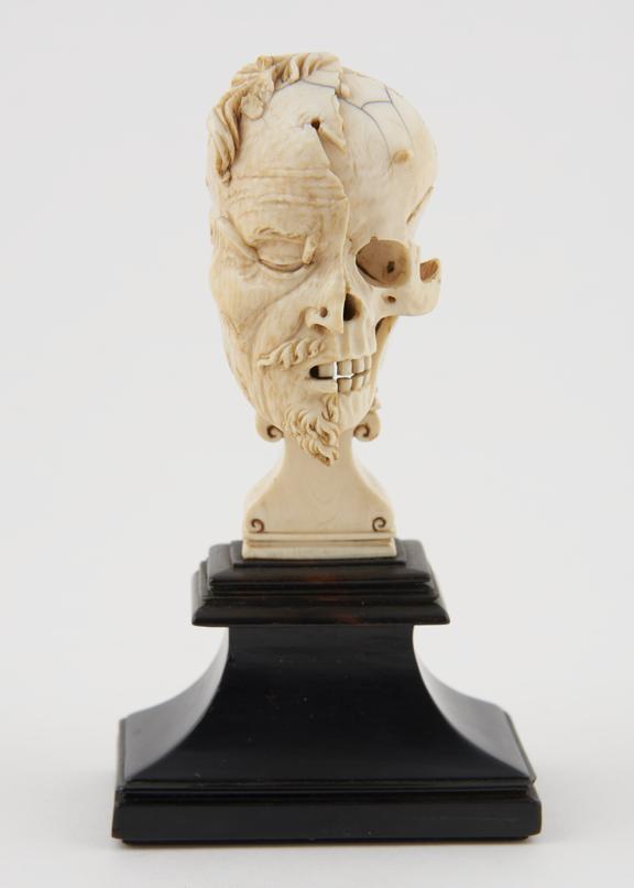 Ivory model of a half head, half skull