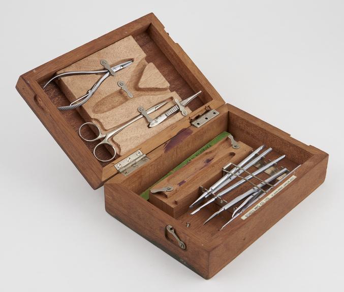 Set of chiropodial instruments in wooden case, by Scholl