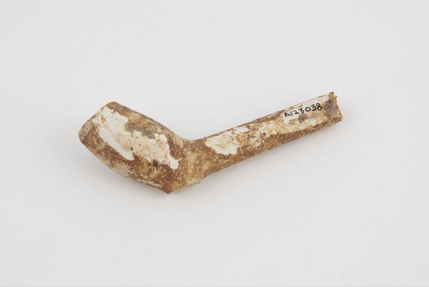 Clay tobacco pipe, incomplete, iron-stained, made in England